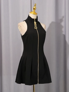 Sleeveless black mini dress with high collar and full-length gold gothic cross zipper