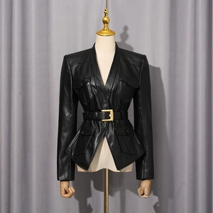 Detail of black slim leather jacket with four pockets and gold buckle belt
