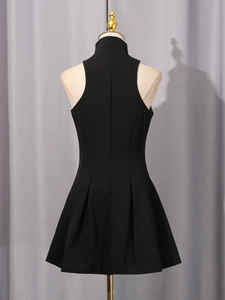 Elegant black sleeveless high neck mini dress with pleated hem on display mannequin