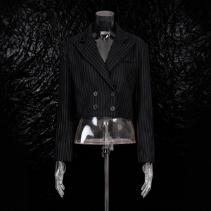 Detail of cropped black pinstripe blazer with double-breasted buttons and notched lapels