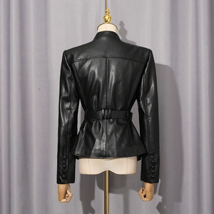 Detailed view of women's black leather jacket featuring buttoned cuffs and waist belt