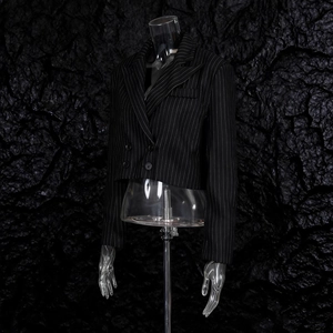 Detail of cropped pinstripe double-breasted blazer with peaked lapels and four buttons