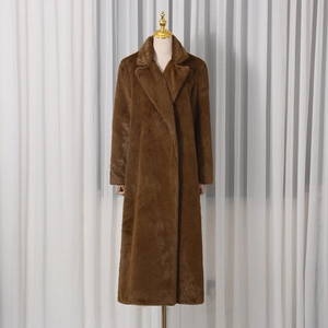 Close-up of caramel faux fur coat featuring wide lapels and luxurious thick texture