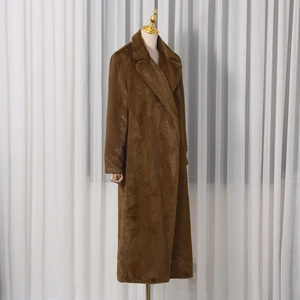 Close-up of thick brown faux fur texture and wide lapel collar on long winter coat