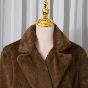 Close-up of lapel detail on a premium thick dark brown faux fur long coat for women