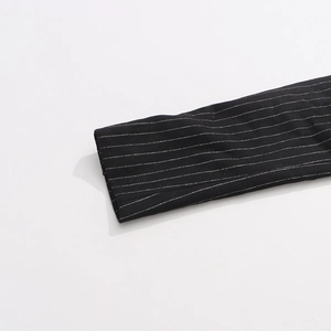 Detailed macro view of the striped wool texture and high-quality cuff stitching
