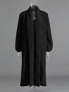 Women's long black quilted coat with diamond patterns and oversized shawl collar