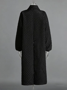 Long black quilted coat for women with classic diamond stitching and back button detail