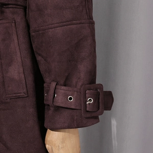 Detail shot of purple faux suede sleeve cuff with adjustable metal eyelet strap