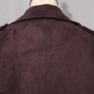 Detail view of the deep burgundy faux suede trench coat collar and shoulder stitching