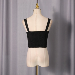 Rear view detail of black smocked camisole with wide straps on a mannequin