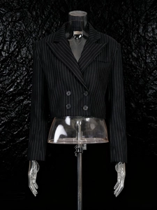 Short double-breasted black pinstripe blazer with peak lapels for a stylish office look