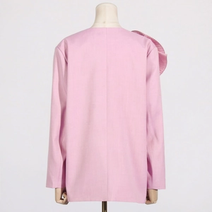 Detailed back view of pink blazer featuring exquisite 3D pleated floral shoulder design