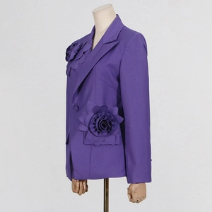 Detailed view of the 3D handcrafted floral design on a deep purple fashion blazer