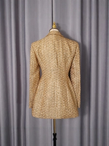 Back view of a gold tweed blazer jacket for women with slim fit and rich woven texture