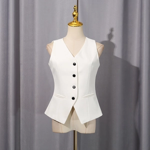 Detail of white V-neck tailored vest with black buttons and professional sleek finish