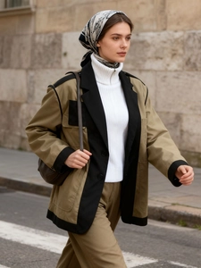 Women's two-tone khaki and black patchwork blazer styled with chic autumn accessories