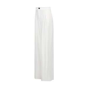 Detail of high-waisted white wide-leg trousers with elegant black button and fluid drape