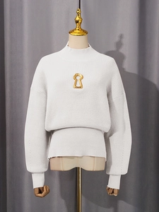 Chic white knit sweater with mock neck and golden keyhole metal detail in relaxed fit