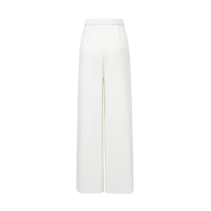 Detail view of the back of high-waist wide-leg trousers with clean white fabric finish
