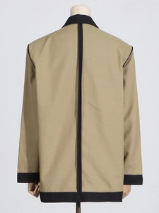 Back view of khaki blazer with black contrast trim and vertical seam detailing
