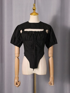 Two-piece street style set featuring lantern sleeve blouse and boned hem camisole in black