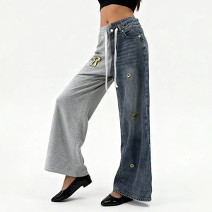 Detail of mixed-media straight-leg pants with grey jersey and blue denim patchwork