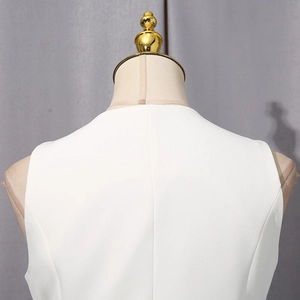 Close-up of white sleeveless vest back neckline and woven texture on a mannequin