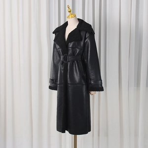 Detailed view of women's long black faux leather trench coat with warm shearling collar