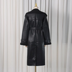 Back view of a long black faux leather trench coat with warm shearling trim and matching belt