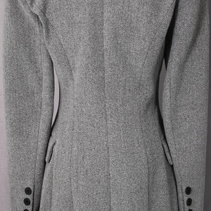 Detail view of heather grey wool coat with tailored back seams and structured waistline