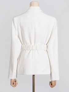 Back view of a sleek white women's blazer featuring a cinched waist for a slim fit