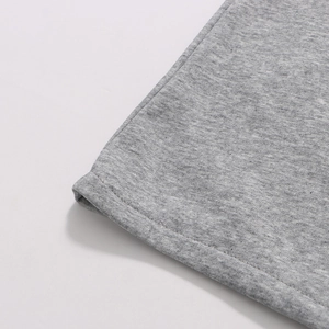 Detailed close-up of high-quality heather grey knit fabric and durable hemmed stitching