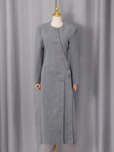 Elegant grey irregular wool coat with asymmetric buttons and long minimalist silhouette