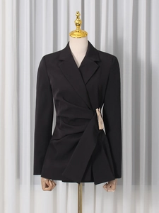 Women's black asymmetrical blazer with draped waist detail and champagne gold buckle accent