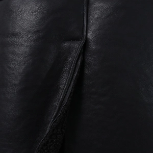 Detail of premium black lychee texture leather jacket with thick fleece lining