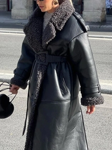Long black faux leather coat with gray fleece collar and waist belt for winter