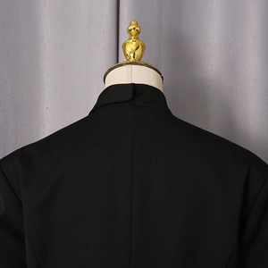 Detail view showing back collar and premium fabric texture of the black tailored blazer