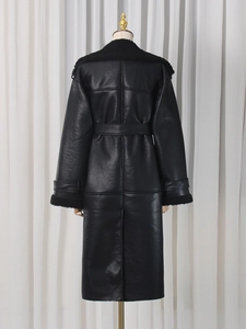 Long black faux leather trench coat with shearling trim and belted back design