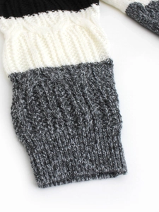 Three-tone cable knit cardigan in black white and grey with ribbed cuffs details