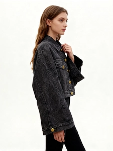 Stylish black washed denim jacket with vintage gold buttons and oversized silhouette