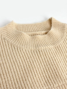 Beige ribbed knit sweater featuring a classic crewneck design and textured stripes