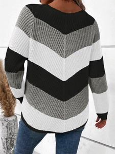 Women's long sleeve knit sweater with black, white, and grey chevron color block design