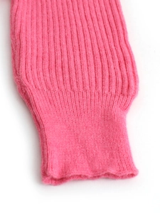 Pink V-neck sweater with long batwing sleeves featuring thick ribbed knit texture details