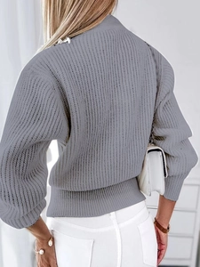 Women's gray knit cardigan with stylish lantern sleeves and a classic ribbed texture