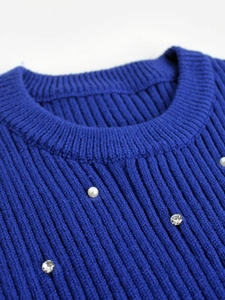 Slim fit navy blue ribbed knit tank top with white pearl and rhinestone neck embellishments