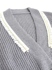 Gray long sleeve knit cardigan sweater with elegant pearl trim and white ruffle edges