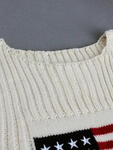 Sleeveless white knit top featuring American flag star and stripe pattern on chest