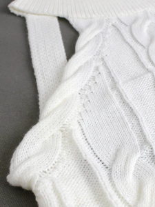 Slim fit ivory white cable-knit vest showing high-quality chunky knit texture detail