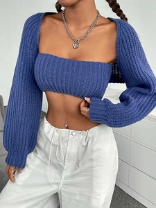 Blue knit two-piece set featuring long sleeve shrug and tube top with ribbed texture